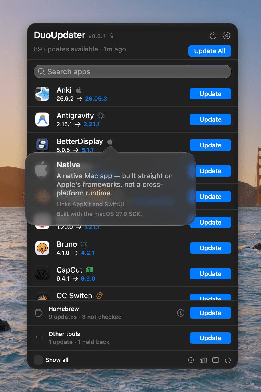The DuoUpdater menu bar popover, headed 89 updates available with an Update All button and a search field. Each row shows the installed version, the new version, a small badge for what the app is built with, and an Update button; Anki's row reads 26.9.2 to 26.09.3. A hover card over BetterDisplay's badge reads: Native — a native Mac app, built straight on Apple's frameworks, not a cross-platform runtime. Links AppKit and SwiftUI. Built with the macOS 27.0 SDK. Two rows at the bottom: Homebrew, 9 updates and 3 not checked; Other tools, 1 update and 1 held back.
